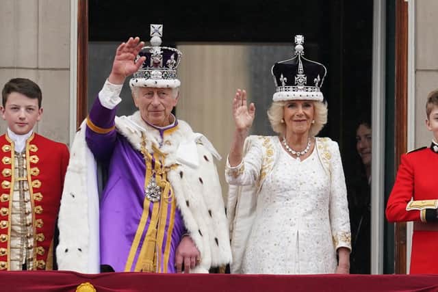 King Charles III and Queen Camilla on the balcony of Buckingham Palace following the coronation on May 6. Picture: Owen Humphreys/PA Wire