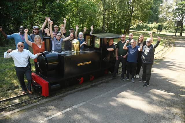 Celebrations as plans to restore Haigh Woodland Railway are back on track, thanks to Wigan Council investment. Pictured are dedicated volunteers who form the Haigh Woodland Supporter's Association (HWRSA) with members of Wigan Council and ward councillors at Haigh Woodland Park.