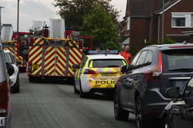 Firefighters remain at the scene of the fatal fire in Newstead Road, Goose Green