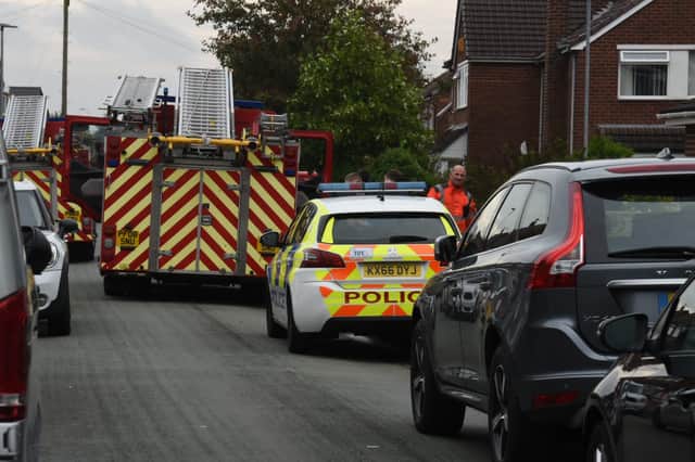 Firefighters remain at the scene of the fatal fire in Newstead Road, Goose Green