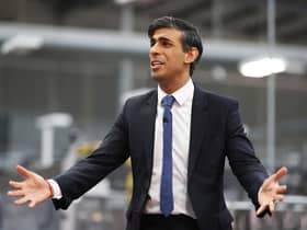 Rishi Sunak talks to local business leaders during a visit to a Coca-Cola factory in Lisburn, Northern Ireland yesterday (Picture: Liam McBurney/WPA pool/Getty Images)