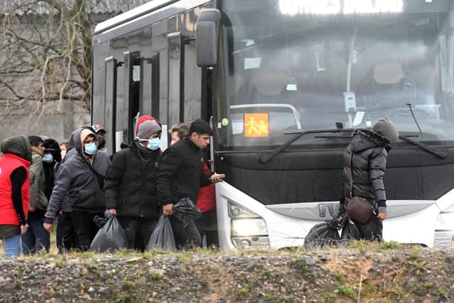 Migrants found soaked after a failed attempt to cross the Channel board a bus in Calais yesterday (Picture: Getty Images)