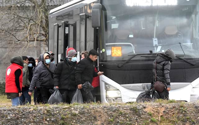 Migrants found soaked after a failed attempt to cross the Channel board a bus in Calais yesterday (Picture: Getty Images)