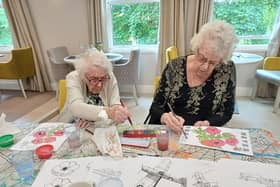 Dorothy Young at Newlands Care Home with fellow resident showing her artistic flair
