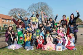 Manchester school welcomes donation of books from local business
