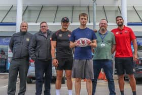Salford Red Devils stars Tim Lafai and Nene MacDonald with representatives from the Salford branches