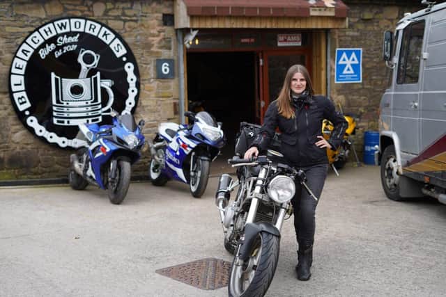 Kate posing with her classic Ducati