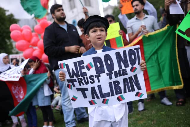 Protesters gather on Parliament Square to protest against the Taliban take over of Afghanistan (Photo by Dan Kitwood/Getty Images)