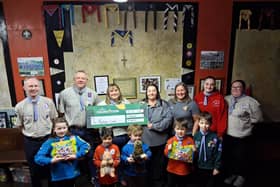 Paul Macrae, Jonathan Collinson-Taylor (7th Manchester Scouts), Lisa Ogunba, Mandy Stockley (Morrisons Community Champions), and Jessica Mawdsley (7th Manchester Scouts) with children that attend 7th Manchester Scouts Group