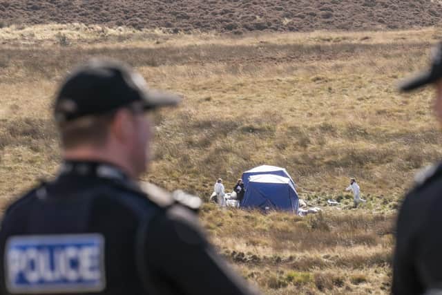 Officers from Greater Manchester Police continue a search on Saddleworth Moor, in north west England, for the remains of the body of 12-year-old Keith Bennett, one of five victims of Ian Brady and Myra Hindley, with three of them later found buried on the moor.