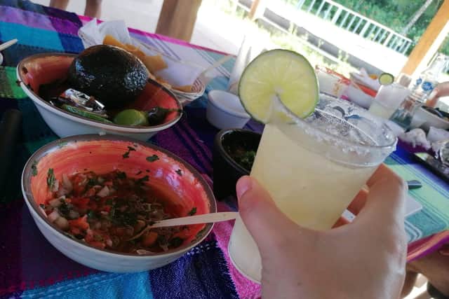 Enjoying margaritas while making salsa during a 'Dance & Salsa' class in Cozumel, Mexico.
