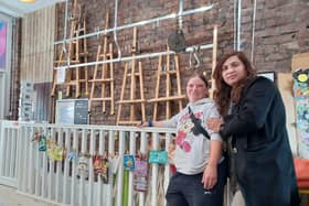 Helen Cassidy and Aisha Mahmood with the rubbish timeline