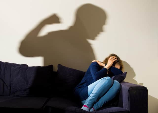 PICTURE POSED BY MODEL File photo dated 09/03/15 of a shadow of a man with a clenched fist as a woman cowers in the corner, as almost 100 domestic abuse incidents were reported to police on Christmas Day last year.