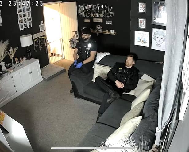 Officers watching television in Abbygail Lawton's home

