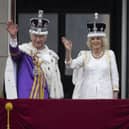 King Charles III and Queen Camilla wave to the crowds from the balcony at Buckingham Palace (Picture: Christopher Furlong/Getty Images)