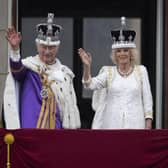 King Charles III and Queen Camilla wave to the crowds from the balcony at Buckingham Palace (Picture: Christopher Furlong/Getty Images)