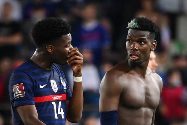 France's midfielder Paul Pogba (R) reacts as he speaks with France's midfielder Aurelien Tchouameni (L) at the end of the FIFA World Cup Qatar 2022 qualification Group D football match between France and Bosnia-Herzegovina, at the Meineau stadium in Strasbourg, eastern France, on September 1, 2021. (Photo by FRANCK FIFE / AFP) (Photo by FRANCK FIFE/AFP via Getty Images)