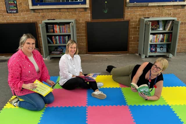 Taylor Wimpey's Lucy Bennett and Sam Evans with Baguley Hall Primary School's Kate Bulman
