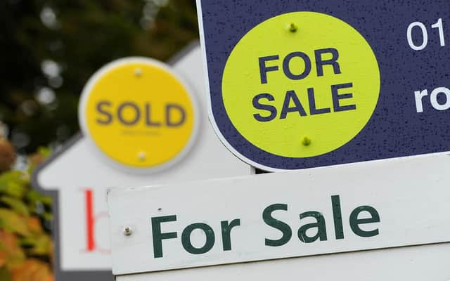 General view of estate agents signs outside a block of flats in Basingstoke, Hampshire.