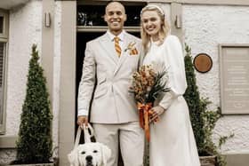 June's son Justin Martey with wife Emily on their wedding day, featuring Murrey the dog