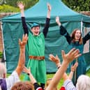 Robin and Marian lead the crowd...