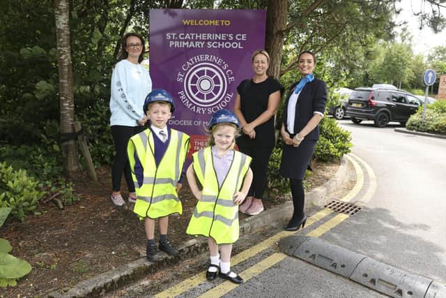 Beatrice Thaell (6), Theo Vinten (6) with Morris Homes sales rep Victoria Coomer and PTA members Ade