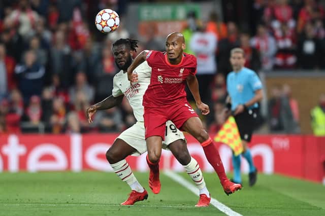 LIVERPOOL, ENGLAND - SEPTEMBER 15: Fabinho of Liverpool is challenged by Franck Kessie of AC Milan during the UEFA Champions League group B match between Liverpool FC and AC Milan at Anfield on September 15, 2021 in Liverpool, England. (Photo by Shaun Botterill/Getty Images)