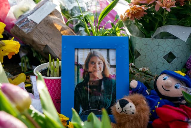 A picture of Sarah Everard sits among flowers left at the bandstand on London's Clapham Common where floral tributes were left in her memory (Picture: Ming Yeung/Getty Images)